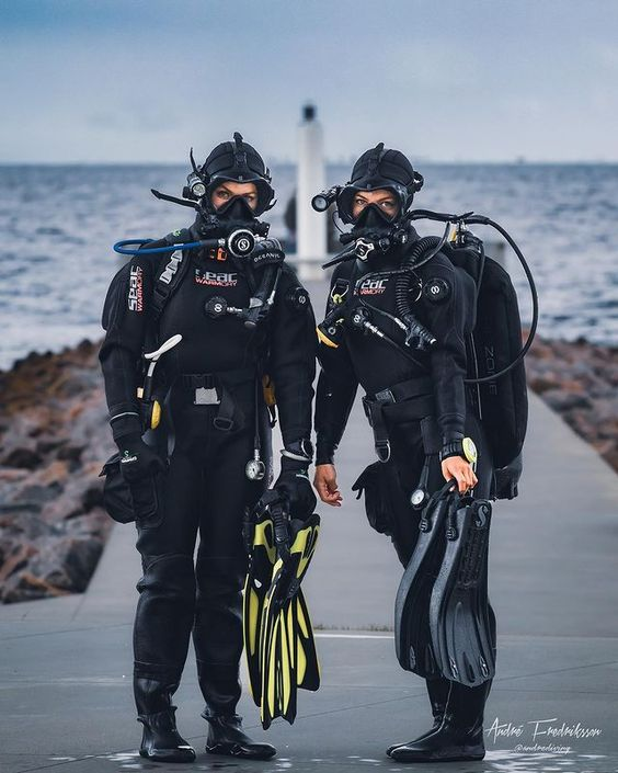 two people wearing the drysuits