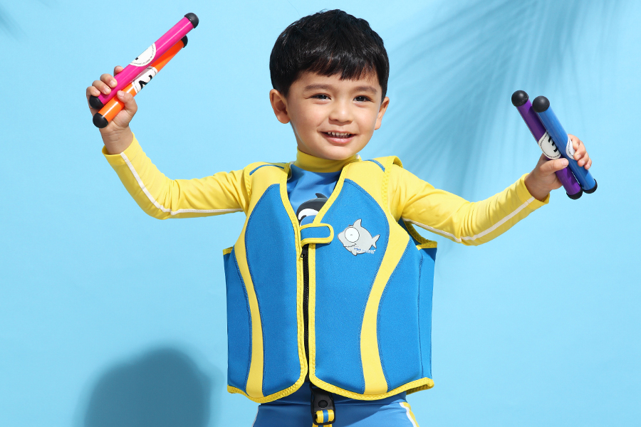 a kid wearing a swim vest