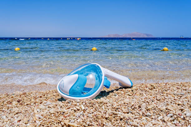 The snorkeling mask is on the beach