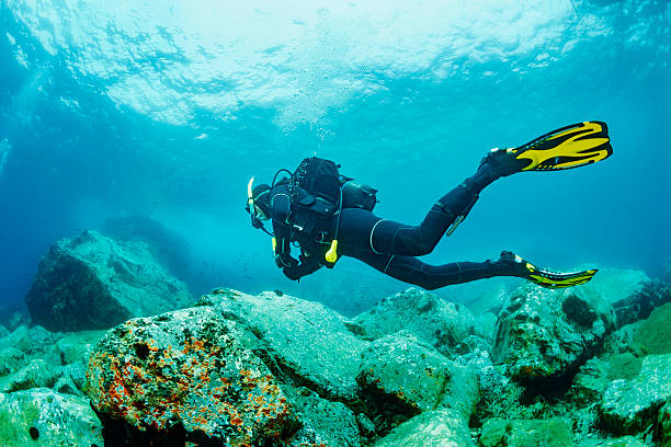 scuba diver in blue lagoon