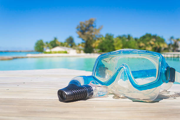 Snorkel scuba mask on the beach.